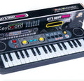 Tafeen Toys 37-key electronic keyboard for kids, black with colorful control buttons and box.